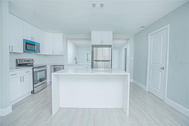 Interior, Kitchen, Recessed Lighting, Stainless Steel Appliances, Wood Texture Flooring