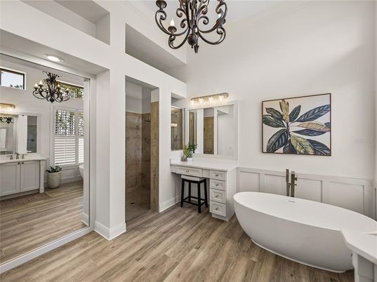 Bathroom, Chandelier, Dual Sink Vanities, Free Standing Baths, Interior, Recessed Lighting, Wood Texture Flooring