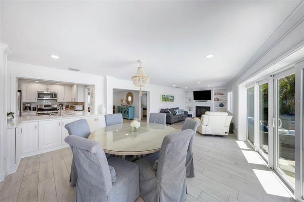 Dining room, Fireplace, Interior, Kitchen, Living room, Pendant Lights, Recessed Lighting, Stainless Steel Appliances, Wood Texture Flooring