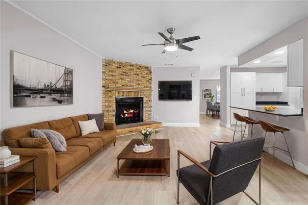 Dining room, Fireplace, Interior, Kitchen, Living room, Recessed Lighting, Stone Walls, Wood Texture Flooring