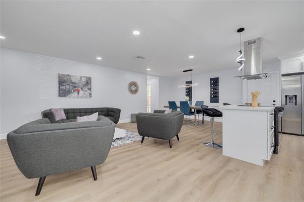 Dining room, Interior, Kitchen, Living room, Pendant Lights, Recessed Lighting, Stainless Steel Appliances, Wood Texture Flooring