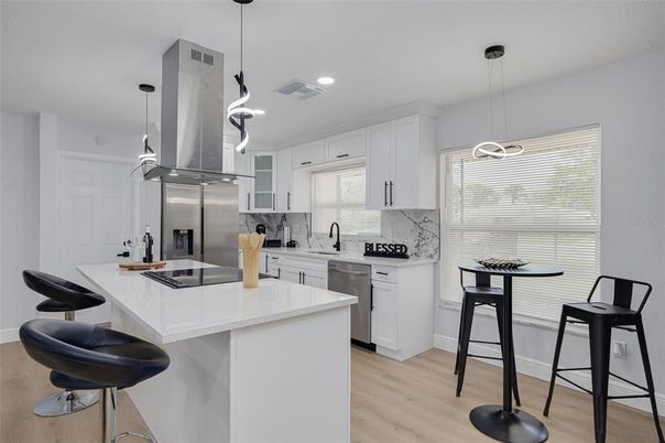 Interior, Kitchen, Pendant Lights, Recessed Lighting, Stainless Steel Appliances, Wood Texture Flooring