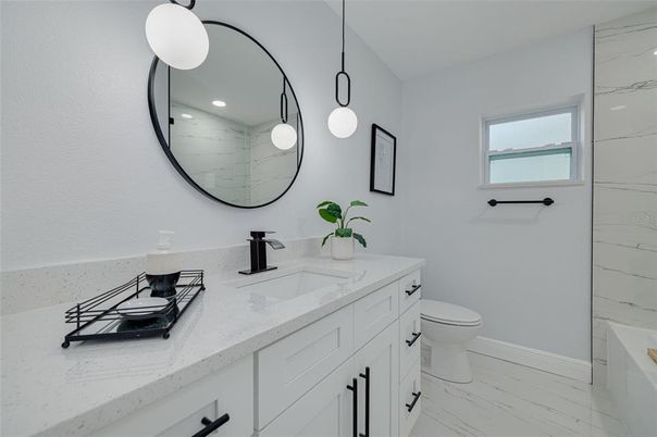 Bathroom, Dual Sink Vanities, Interior, Marble, Marble Walls, Pendant Lights, Recessed Lighting
