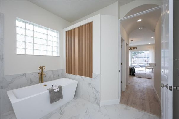 Bathroom, Free Standing Baths, Interior, Marble, Marble Walls, Pendant Lights, Recessed Lighting, Wood Texture Flooring