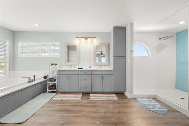 Bathroom, Dual Sink Vanities, Glass Shower, Interior, Recessed Lighting, Wood Texture Flooring