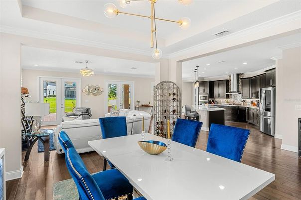 Dining room, Interior, Kitchen, Living room, Pendant Lights, Recessed Lighting, Stainless Steel Appliances, Wood Texture Flooring