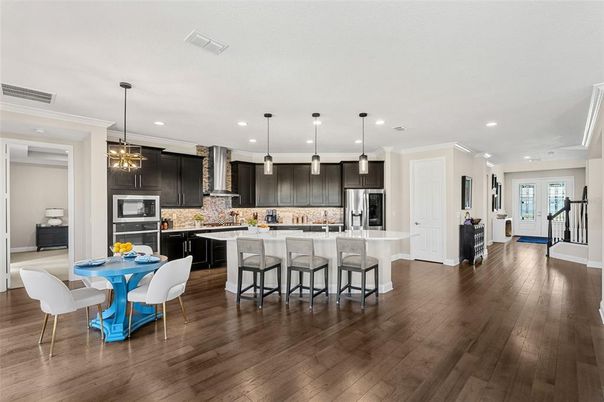 Dining room, Interior, Kitchen, Pendant Lights, Recessed Lighting, Stainless Steel Appliances, Wood Texture Flooring