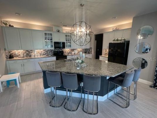 Chandelier, Interior, Kitchen, Pendant Lights, Recessed Lighting, Stainless Steel Appliances, Wood Texture Flooring
