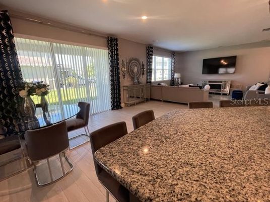 Dining room, Fireplace, Interior, Living room, Recessed Lighting, Wood Texture Flooring