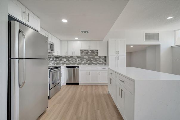 Interior, Kitchen, Recessed Lighting, Stainless Steel Appliances, Wood Texture Flooring