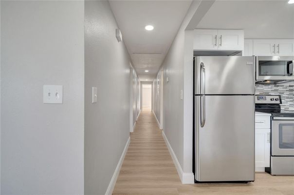 Interior, Kitchen, Recessed Lighting, Stainless Steel Appliances, Wood Texture Flooring