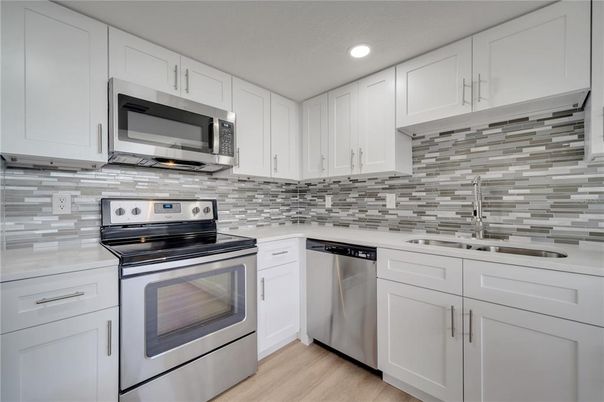 Interior, Kitchen, Recessed Lighting, Stainless Steel Appliances, Wood Texture Flooring