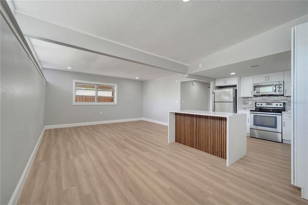 Interior, Kitchen, Recessed Lighting, Stainless Steel Appliances, Wood Texture Flooring