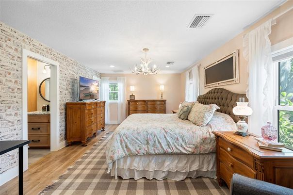 Bedroom, Chandelier, Interior, Recessed Lighting, Stone Walls, Wood Texture Flooring