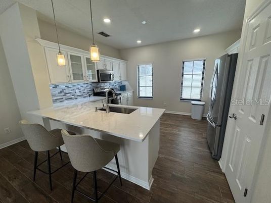 Interior, Kitchen, Pendant Lights, Recessed Lighting, Stainless Steel Appliances, Wood Texture Flooring