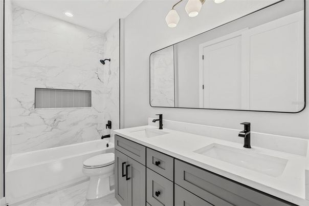 Bathroom, Dual Sink Vanities, Interior, Marble, Marble Walls, Recessed Lighting