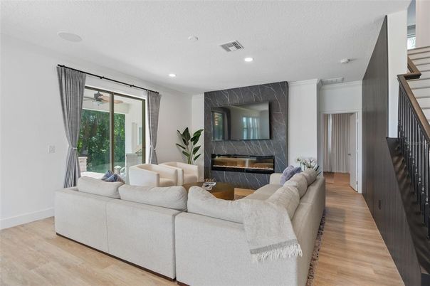 Fireplace, Interior, Living room, Marble Walls, Recessed Lighting, Wood Texture Flooring