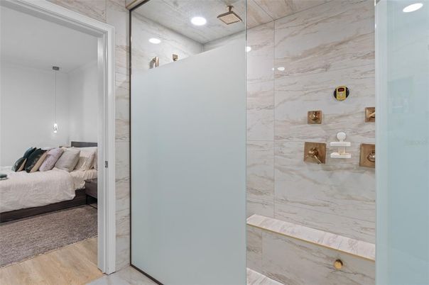 Bathroom, Bedroom, Glass Shower, Interior, Marble Walls, Recessed Lighting, Wood Texture Flooring