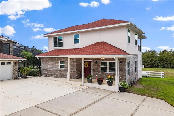 Attached, Exterior, Facade, Brick Facade, American Foursquare