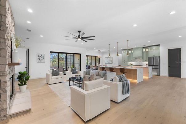 Fireplace, Interior, Kitchen, Living room, Pendant Lights, Recessed Lighting, Stainless Steel Appliances, Wood Texture Flooring