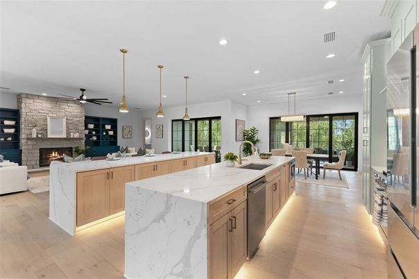Dining room, Fireplace, Interior, Kitchen, Living room, Pendant Lights, Recessed Lighting, Stainless Steel Appliances, Stone Walls, Wood Texture Flooring