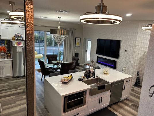 Dining room, Interior, Kitchen, Pendant Lights, Recessed Lighting, Stainless Steel Appliances, Wood Texture Flooring