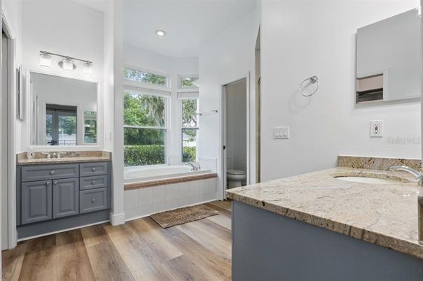 Bathroom, Dual Sink Vanities, Interior, Recessed Lighting, Wood Texture Flooring