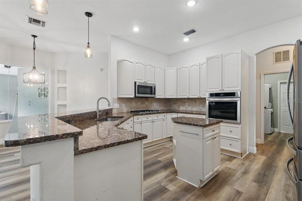 Interior, Kitchen, Pendant Lights, Recessed Lighting, Stainless Steel Appliances, Wood Texture Flooring