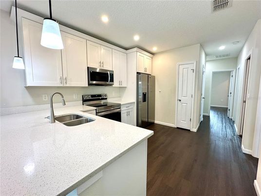Interior, Kitchen, Pendant Lights, Recessed Lighting, Stainless Steel Appliances, Wood Texture Flooring