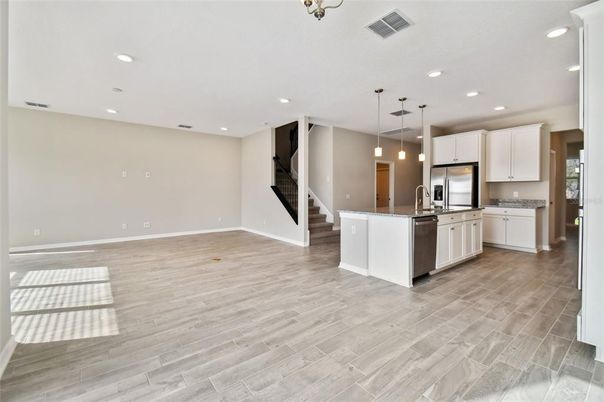 Interior, Kitchen, Pendant Lights, Recessed Lighting, Stainless Steel Appliances, Wood Texture Flooring