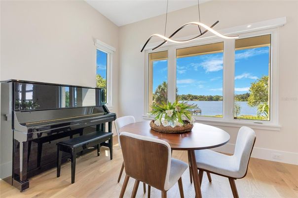 Dining room, Interior, Pendant Lights, Piano, Water, Wood Texture Flooring