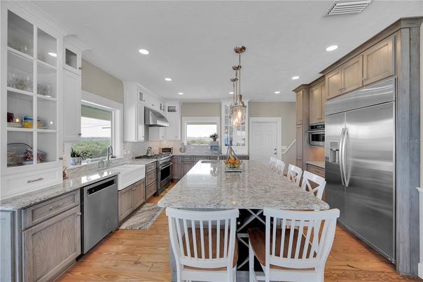Dining room, Interior, Kitchen, Pendant Lights, Recessed Lighting, Stainless Steel Appliances, Wood Texture Flooring