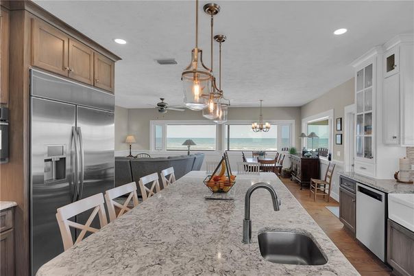 Chandelier, Dining room, Interior, Kitchen, Pendant Lights, Recessed Lighting, Stainless Steel Appliances, Water, Wood Texture Flooring