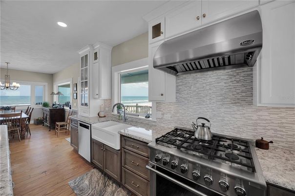 Chandelier, Dining room, Interior, Kitchen, Recessed Lighting, Stainless Steel Appliances, Water, Wood Texture Flooring