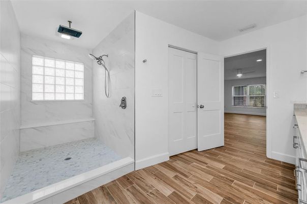 Bathroom, Glass Shower, Interior, Marble Walls, Recessed Lighting, Wood Texture Flooring