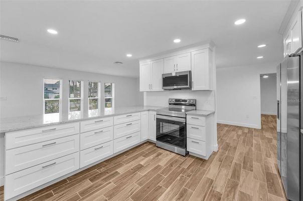 Interior, Kitchen, Recessed Lighting, Stainless Steel Appliances, Wood Texture Flooring