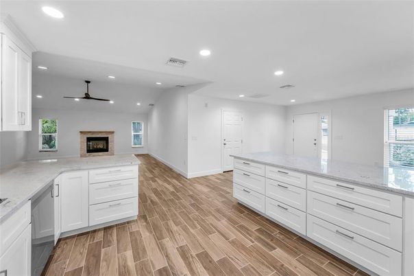 Fireplace, Interior, Kitchen, Recessed Lighting, Wood Texture Flooring