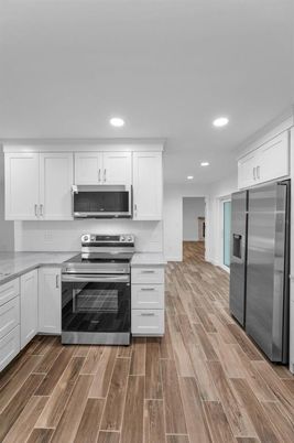 Interior, Kitchen, Recessed Lighting, Stainless Steel Appliances, Wood Texture Flooring