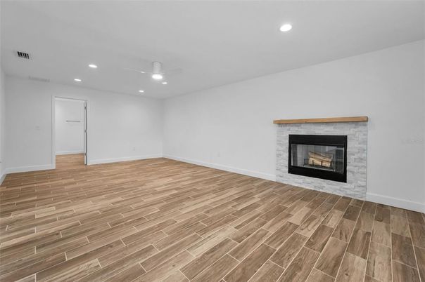 Empty room, Fireplace, Interior, Recessed Lighting, Wood Texture Flooring