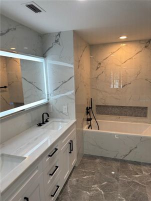 Bathroom, Dual Sink Vanities, Interior, Marble, Marble Walls, Recessed Lighting