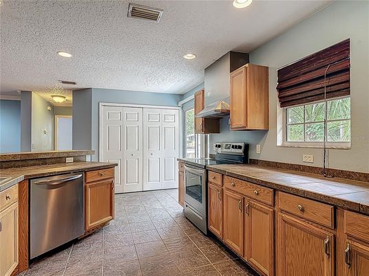 Interior, Kitchen, Recessed Lighting, Stainless Steel Appliances, Tile Countertops