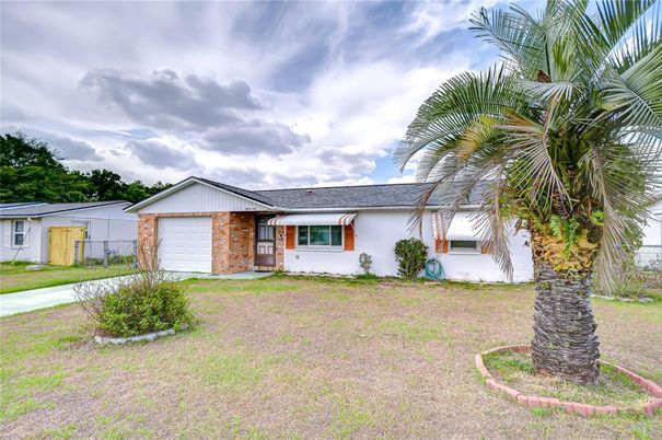 Attached, Backyard, Exterior, Facade, Brick Facade, Ranch