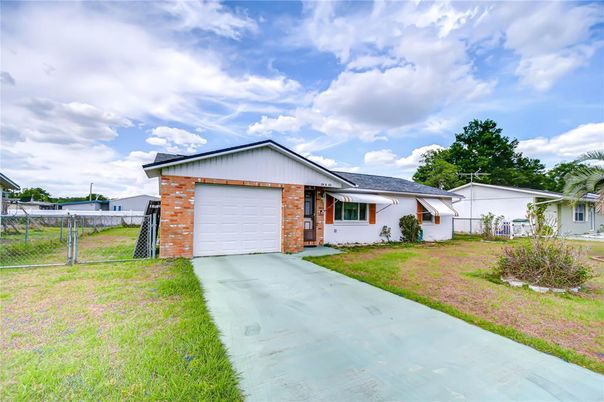 Attached, Backyard, Exterior, Facade, Brick Facade, Ranch