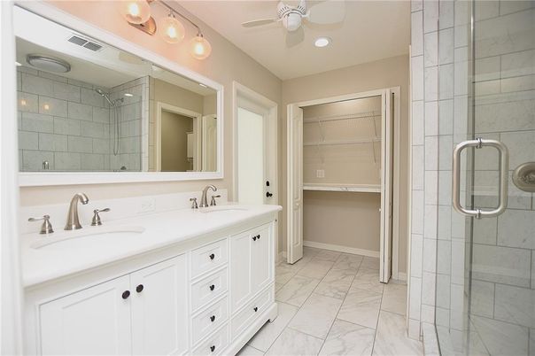 Bathroom, Dual Sink Vanities, Glass Shower, Interior, Marble, Recessed Lighting, Walk-in Closets