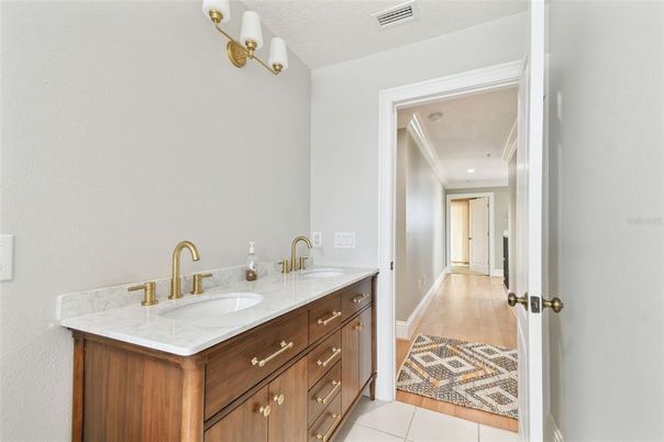 Bathroom, Dual Sink Vanities, Interior, Recessed Lighting, Wood Texture Flooring