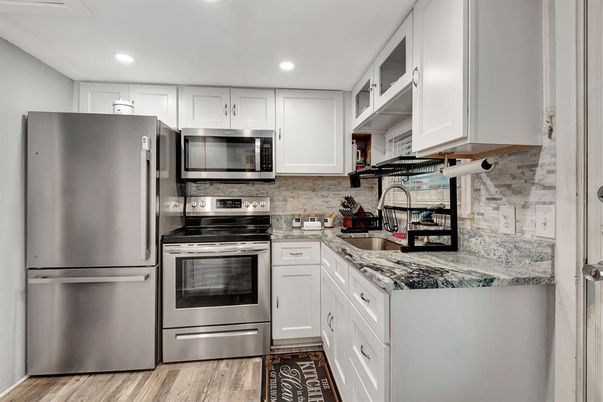Interior, Kitchen, Recessed Lighting, Stainless Steel Appliances, Wood Texture Flooring