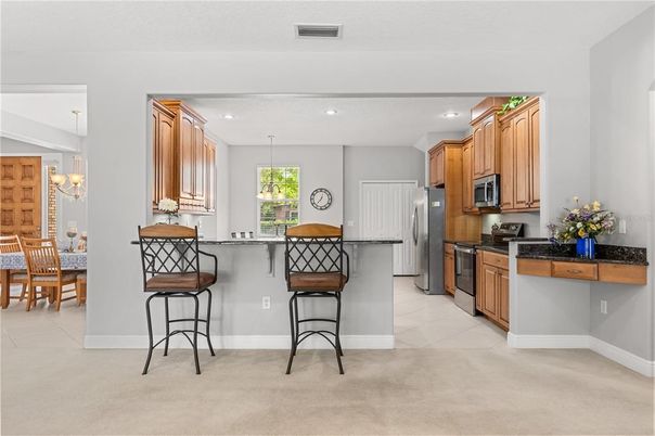 Chandelier, Dining room, Interior, Kitchen, Pendant Lights, Recessed Lighting, Stainless Steel Appliances