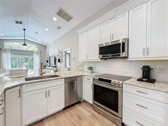 Interior, Kitchen, Recessed Lighting, Stainless Steel Appliances, Wood Texture Flooring