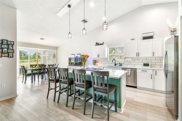 Dining room, Interior, Kitchen, Pendant Lights, Recessed Lighting, Stainless Steel Appliances, Wood Texture Flooring