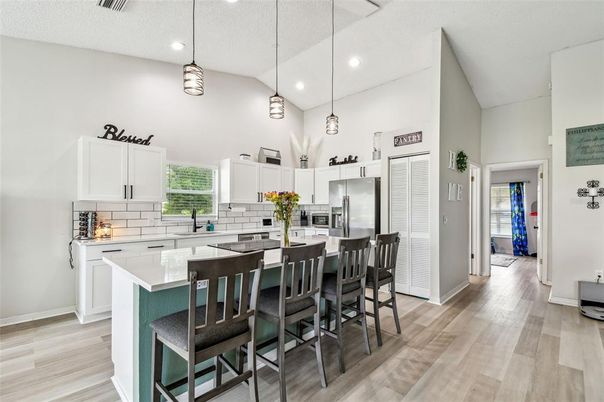 Interior, Kitchen, Pendant Lights, Recessed Lighting, Stainless Steel Appliances, Wood Texture Flooring